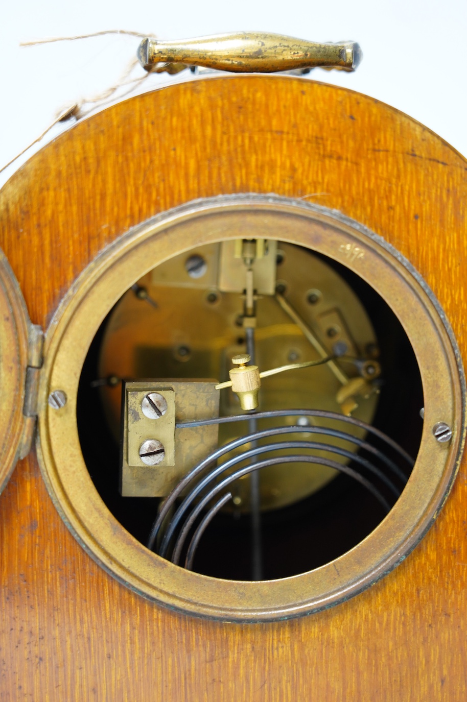 A 19th century mahogany eight day mantel clock with enamel dial and pendulum, 30cm high. Condition - fair, not tested